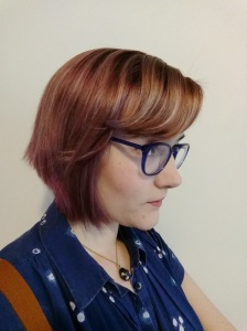 Faded purple hair, side view.